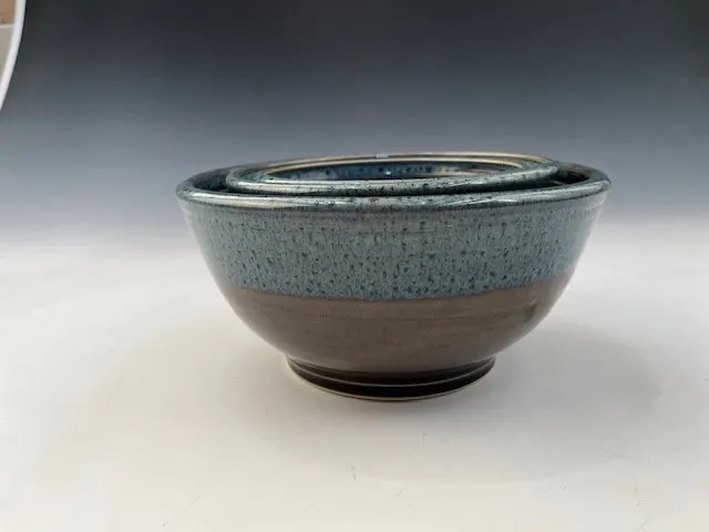 Blue-grey stoneware bowl with a dark chocolate-brown base