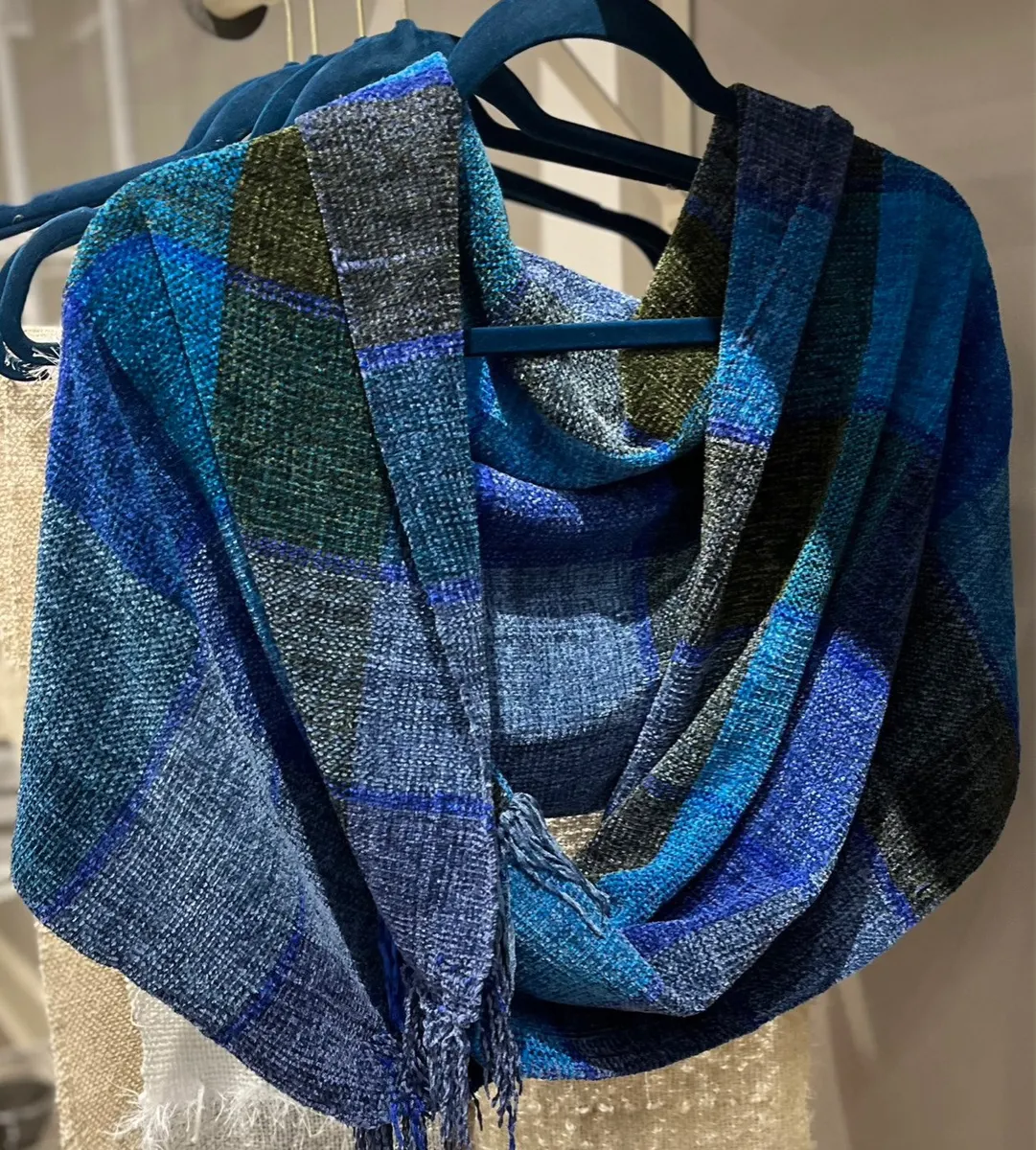 Handwoven wrap in blocks of blue, navy and olive with fringe