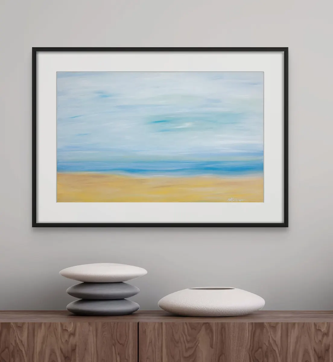 Framed horizontal abstract in pale blue and sand above a wooden console