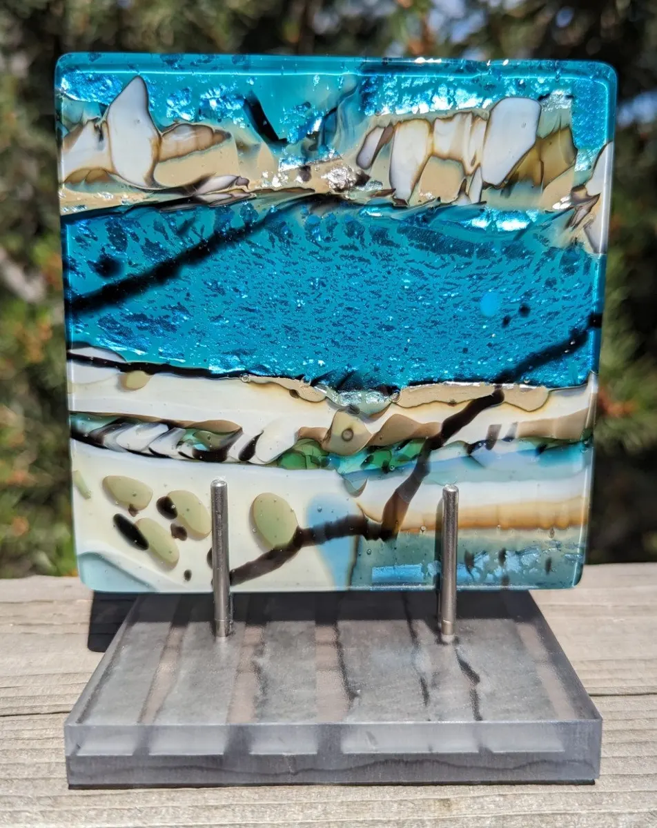 Fused glass panel in turquoise and cream with branching dark lines
