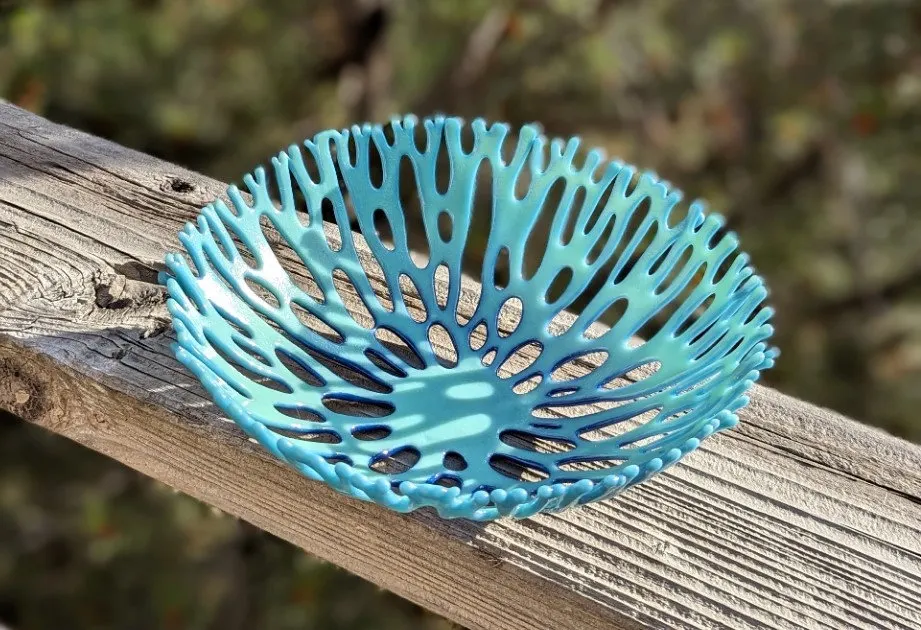 Openwork fused glass bowl in aqua resembling branching coral