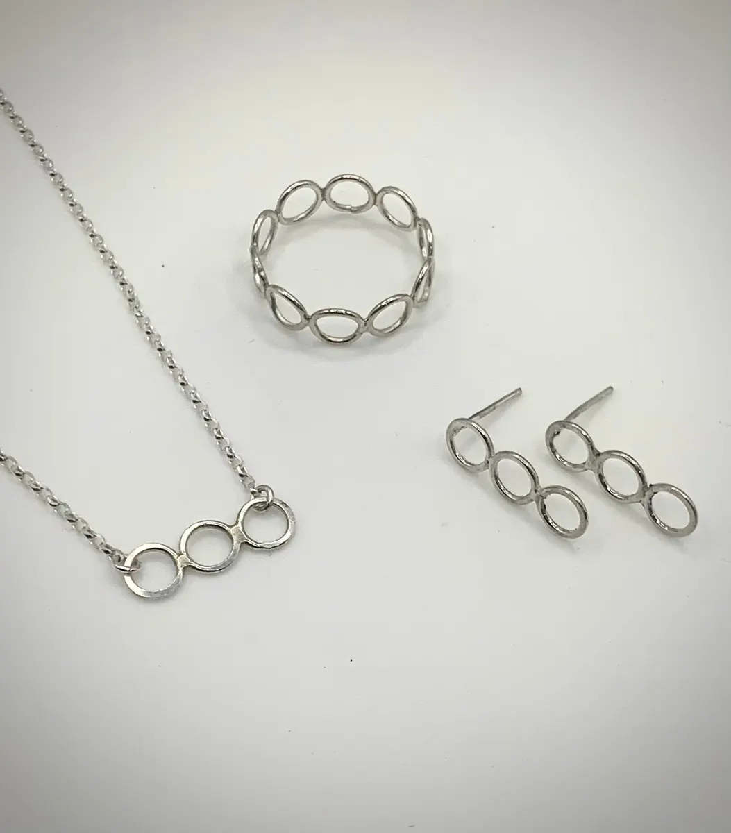 Silver chain necklace, linked-circle bracelet and matching stud earrings