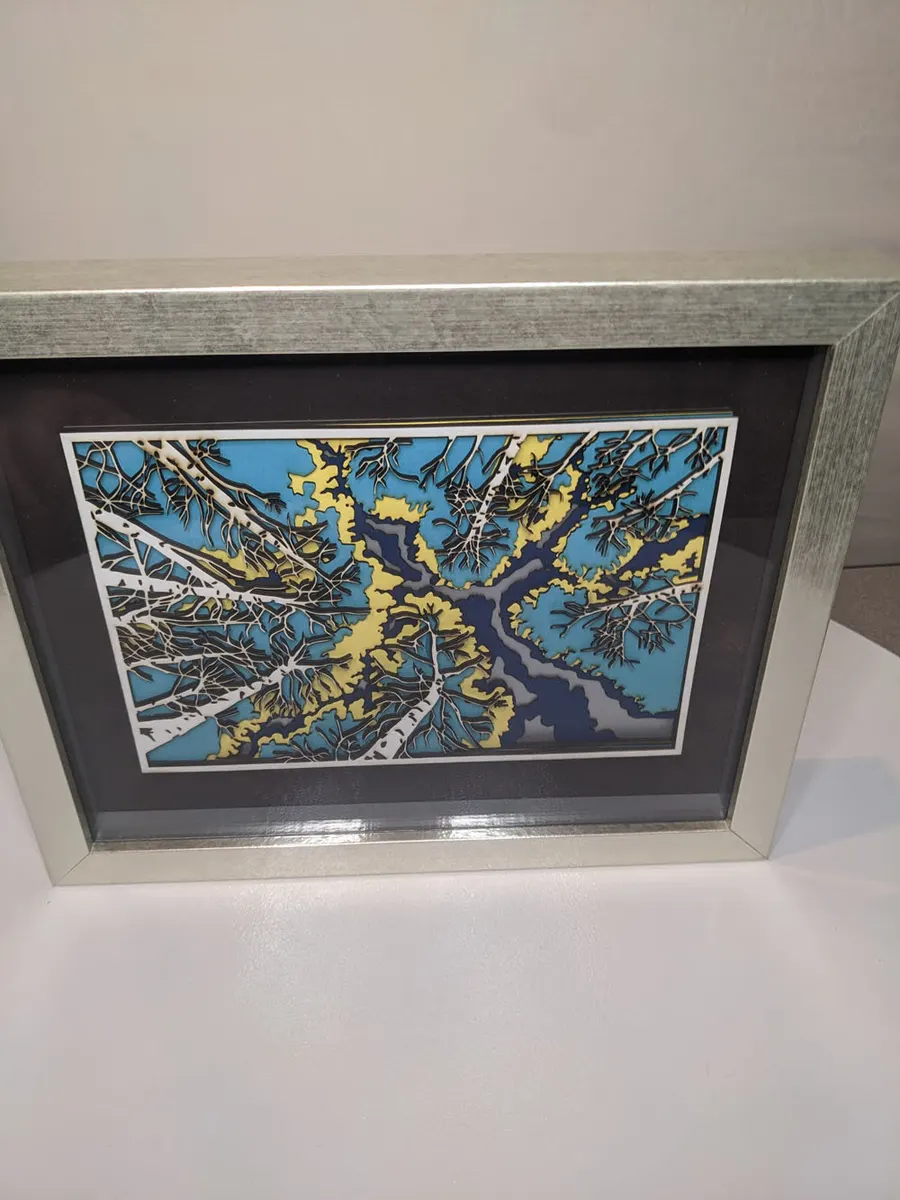 Layered laser-cut aspen canopy in blue and cream, framed