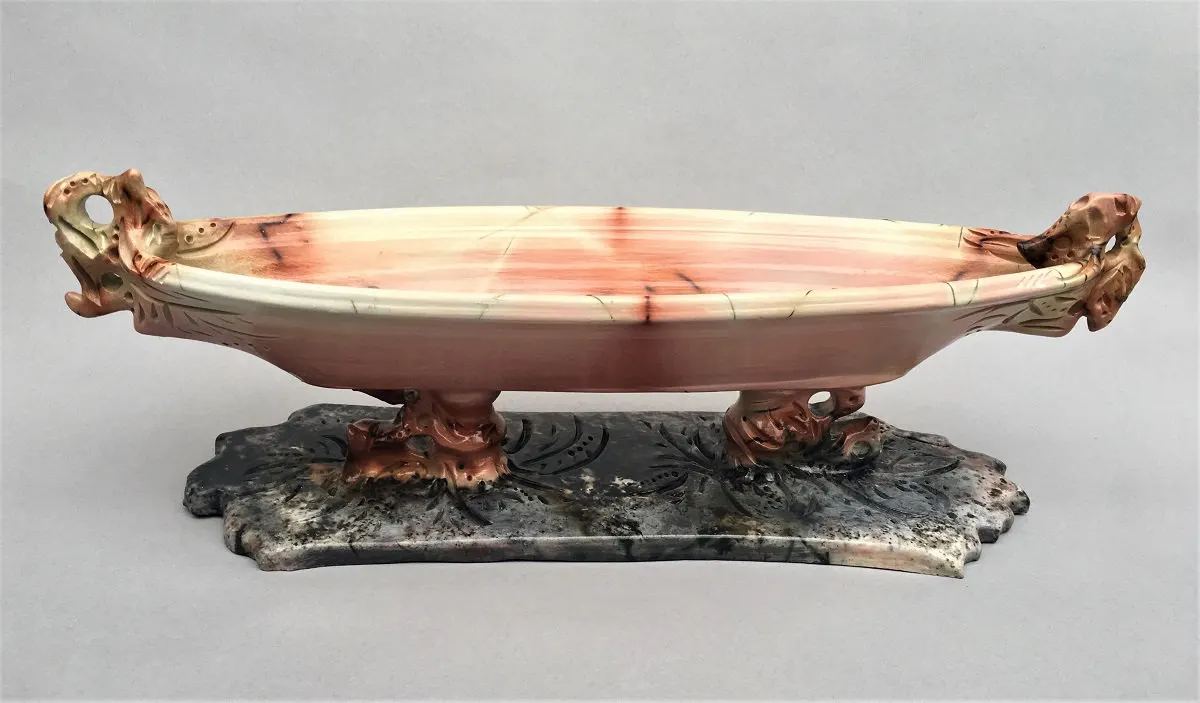 Long oval footed dish with sculpted feet in pink and grey