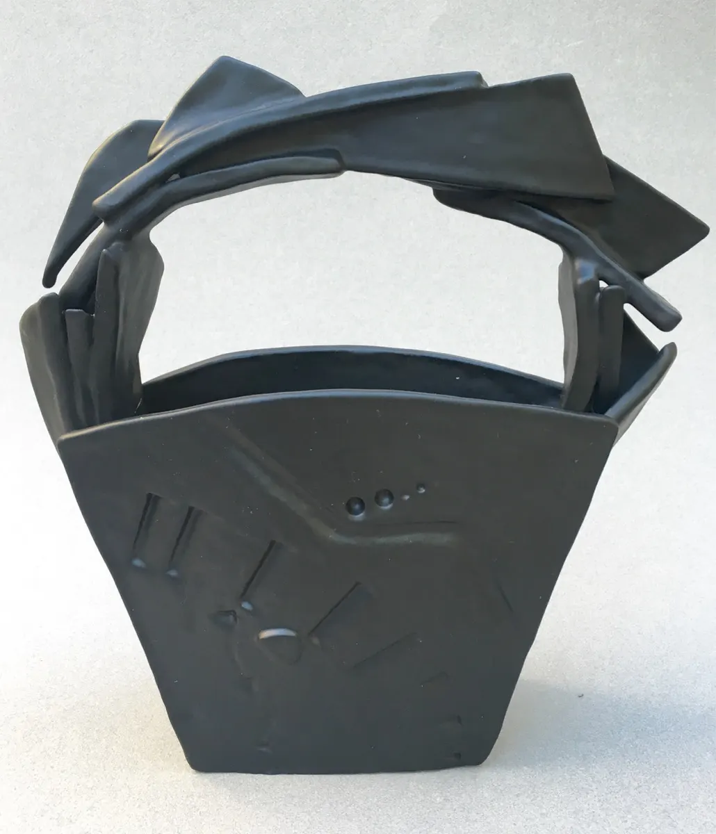 Angular slab-built basket form in matte black