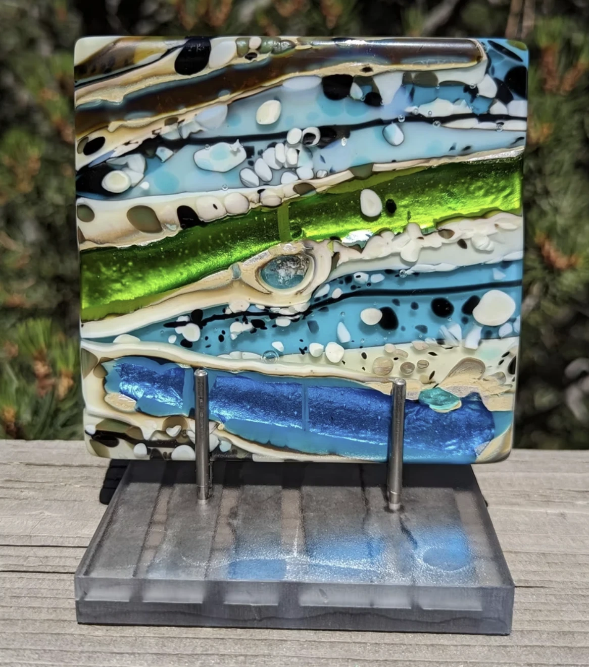 Abstract fused-glass panel in blue, green, and cream